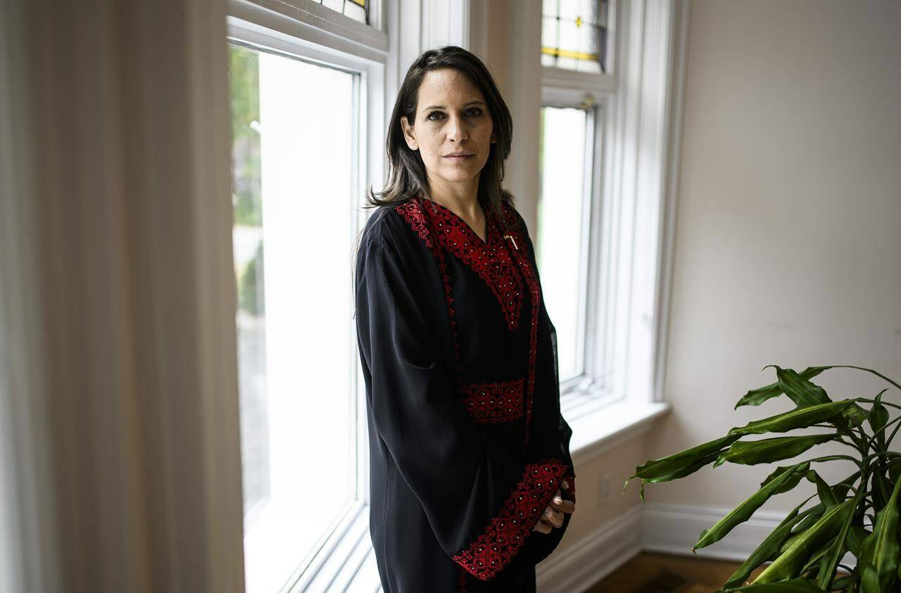 Ambassador Mona Abuamara, Chief Representative of the Palestinian General Delegation, participates in an interview in her office in Ottawa, on Tuesday, Oct. 17, 2023. Abuamara is praising Canada’s vote at the United Nations this week, which called for a humanitarian ceasefire in the Gaza Strip.THE CANADIAN PRESS/Justin Tang
