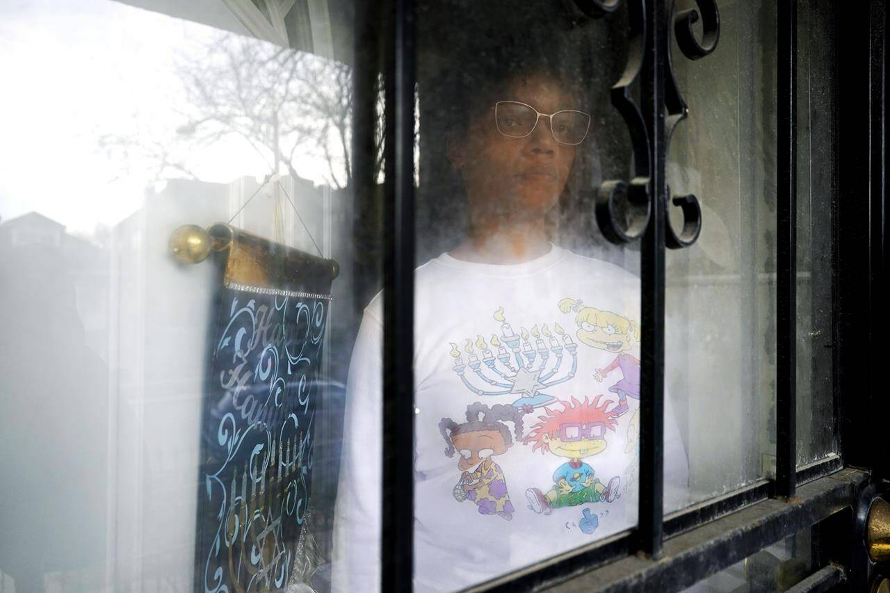 Cydney Wallace poses for a photo in Chicago, Tuesday, Nov. 28, 2023. Cydney Wallace is a Black Jewish woman who recently went on a trip to Israel and the West Bank through a trip called “Black Jerusalem” that was focused on exploring “the sacred geography of Jerusalem through a framework that privileges a Black American and an African lens.” (AP Photo/Nam Y. Huh)