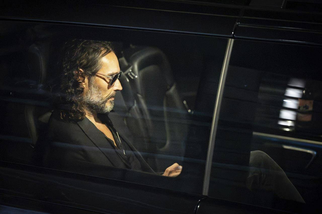 Russell Brand leaves the Troubabour Wembley Park theater in northwest London after performing a comedy set on Saturday, Sept. 16, 2023. Three British news organizations are reporting that comedian and social influencer has been accused of rape, sexual assault and abuse based on allegations from four women who knew him over a seven-year period at the height of his fame. Brand denied the allegations. (James Manning/PA via AP)