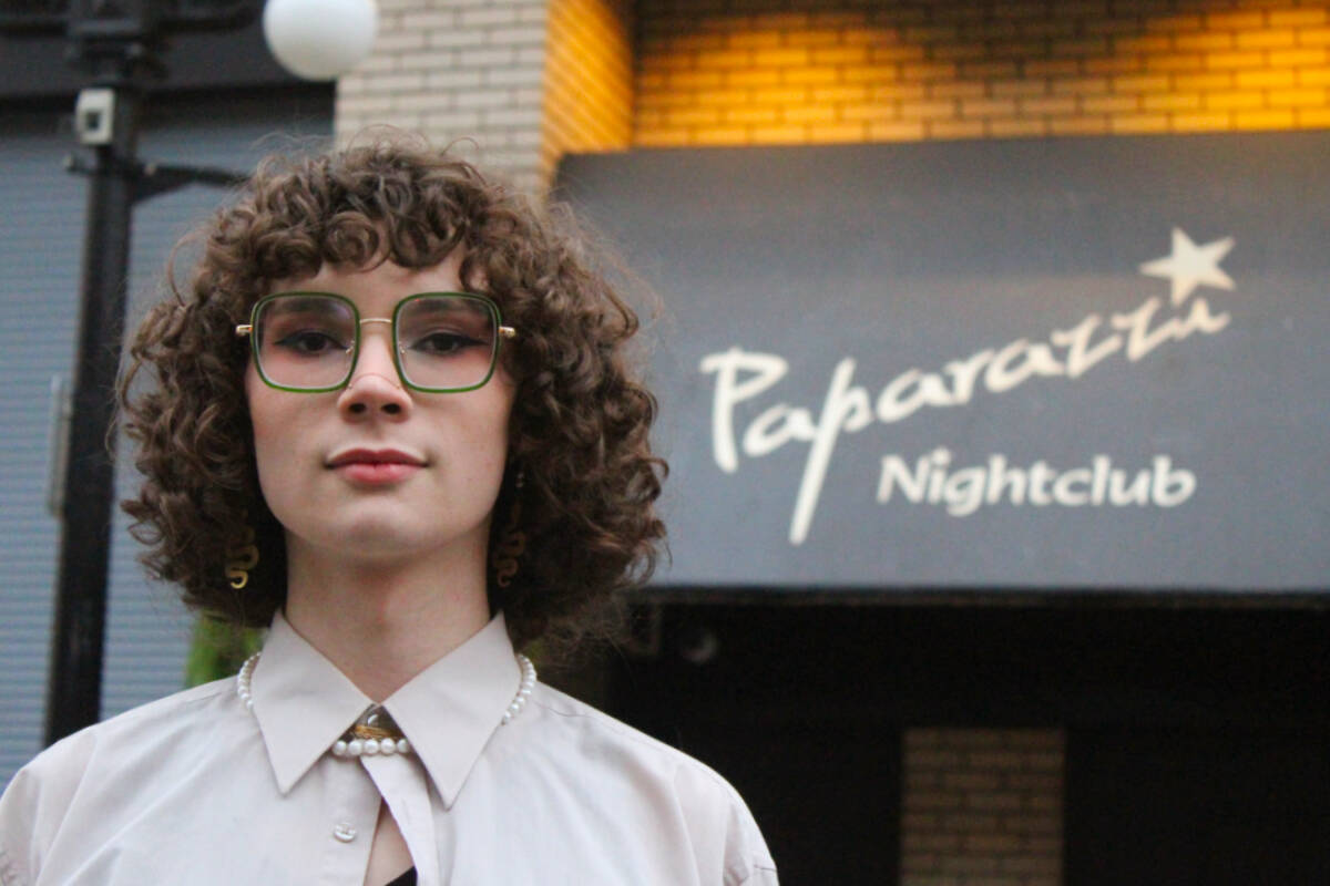 Cleo Philp stands in front of Paparazzi Nightclub, which she describes as the “best-case study” of a spot that used to be branded as a queer space. (Ella Matte/News Staff)