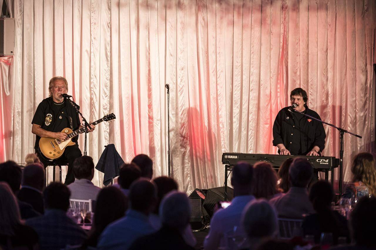 Burton Cummings, left, and Randy Bachman perform during a Canada’s Walk of Fame fundraising event in Toronto on July, 18, 2019. A lawsuit filed by Burton Cummings and Randy Bachman against two of their former band mates in the Guess Who is being called “a complete farce” by the musicians who are seeking to see it dismissed. Drummer Garry Peterson and bassist Jim Kale filed a motion earlier this month asking a Los Angeles court to throw out allegations they’ve infringed on the trademarks for the Winnipeg band. THE CANADIAN PRESS/Christopher Katsarov