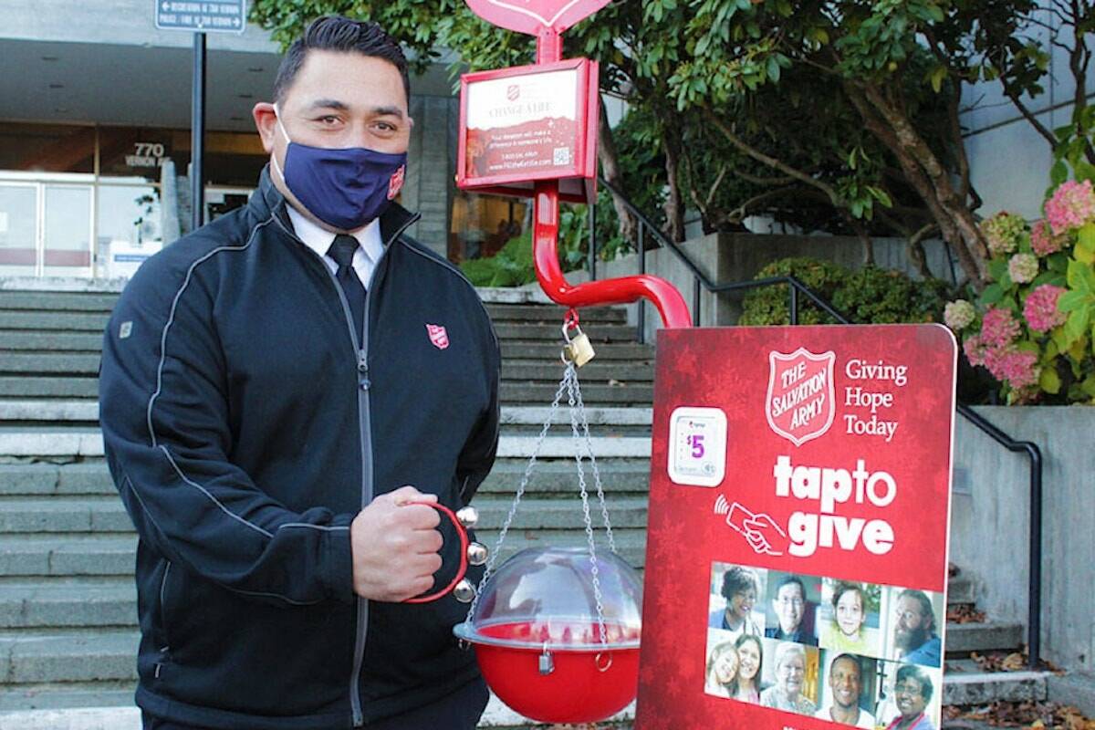 Salvation Army marketing and communications specialist Sipili Molia collects donations during a Christmas Kettle campaign. (Black Press Media file photo)
