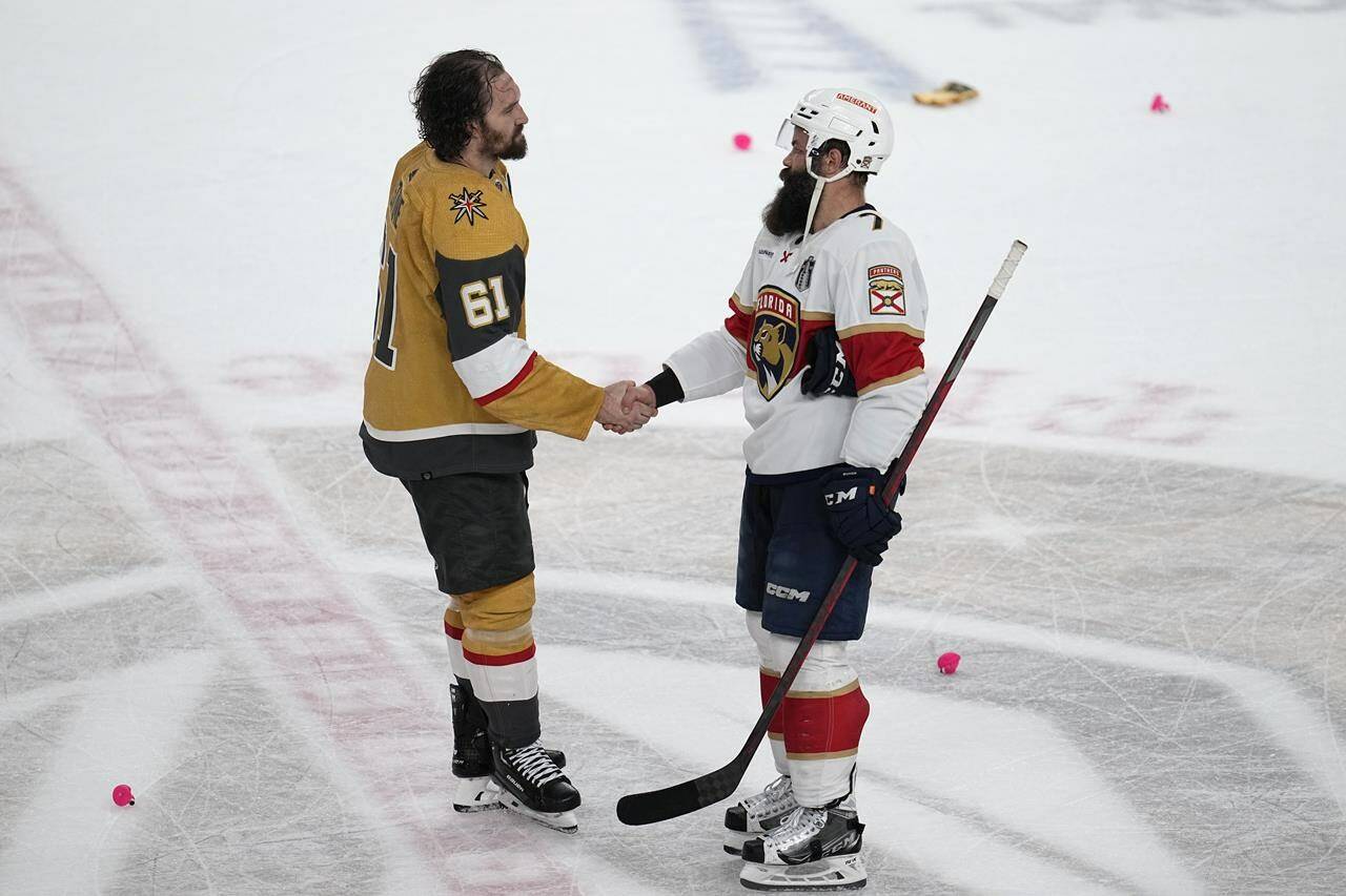 Vegas Golden Knights Mark Stone (61), left, and Florida Panthers Radko Gudas (7) shake hands after Vegas won the Stanley Cup in Game 5 of the NHL hockey Stanley Cup Finals Tuesday, June 13, 2023, in Las Vegas. The governing body for amateur hockey in Newfoundland and Labrador has banned end-of-game handshakes. A post today on Hockey NL’s website says there have been “issues” with the handshakes “that have led to suspensions for players and coaches.” THE CANADIAN PRESS/AP/Abbie Parr