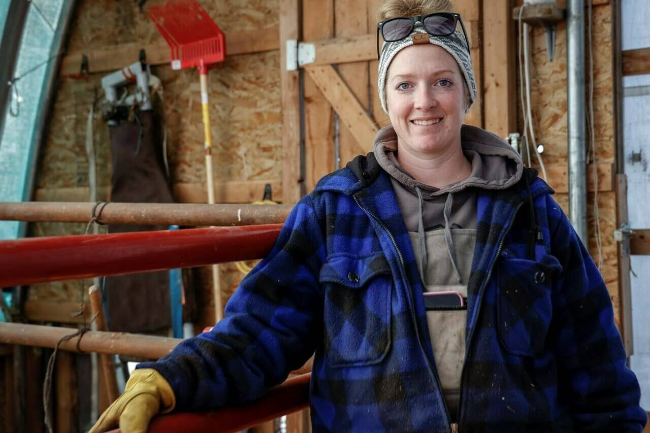 Ashley Perepelkin pauses for a photo on the family’s farm near Leslieville, Alta., Thursday, Nov. 30, 2023. THE CANADIAN PRESS/Jeff McIntosh