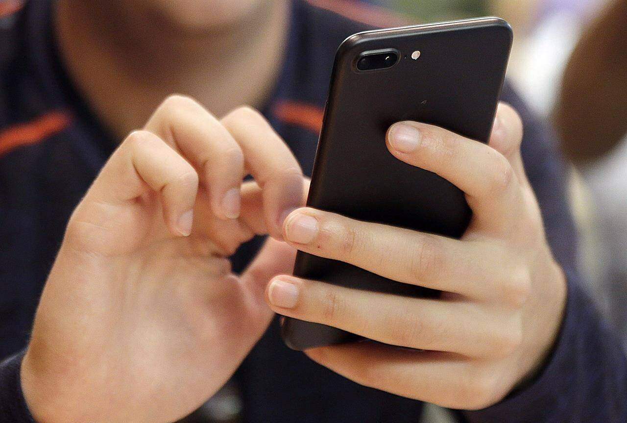 Which social media platform has been banned from government-issued devices in Canada? (THE CANADIAN PRESS/AP)