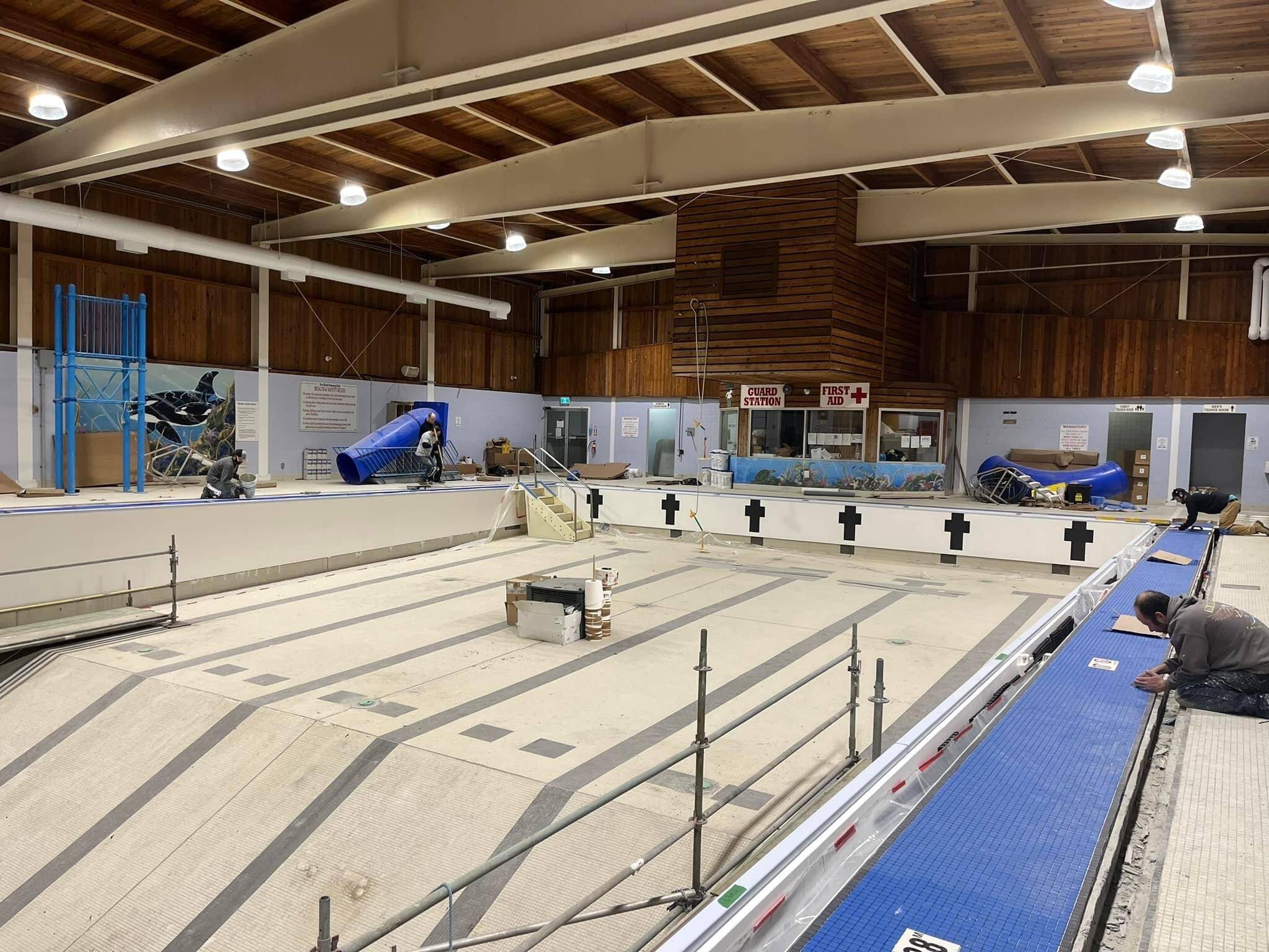 Tile work being done in December on Port Hardy’s indoor swimming pool. (Port Hardy Recreation Facebook photo)