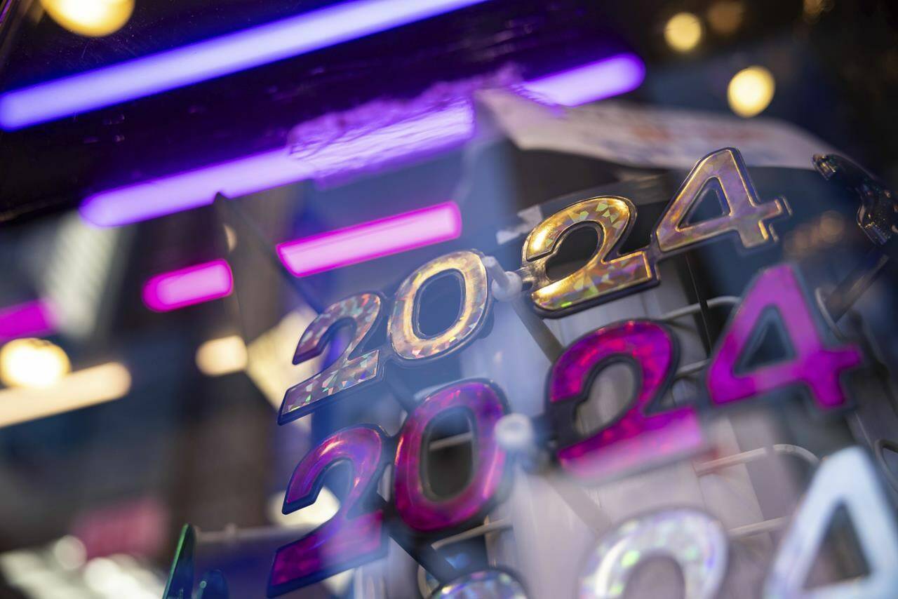 2024 glasses are displayed ahead of New Year’s Eve in Times Square, Friday, Dec. 29, 2023, in New York. (AP Photo/Yuki Iwamura)