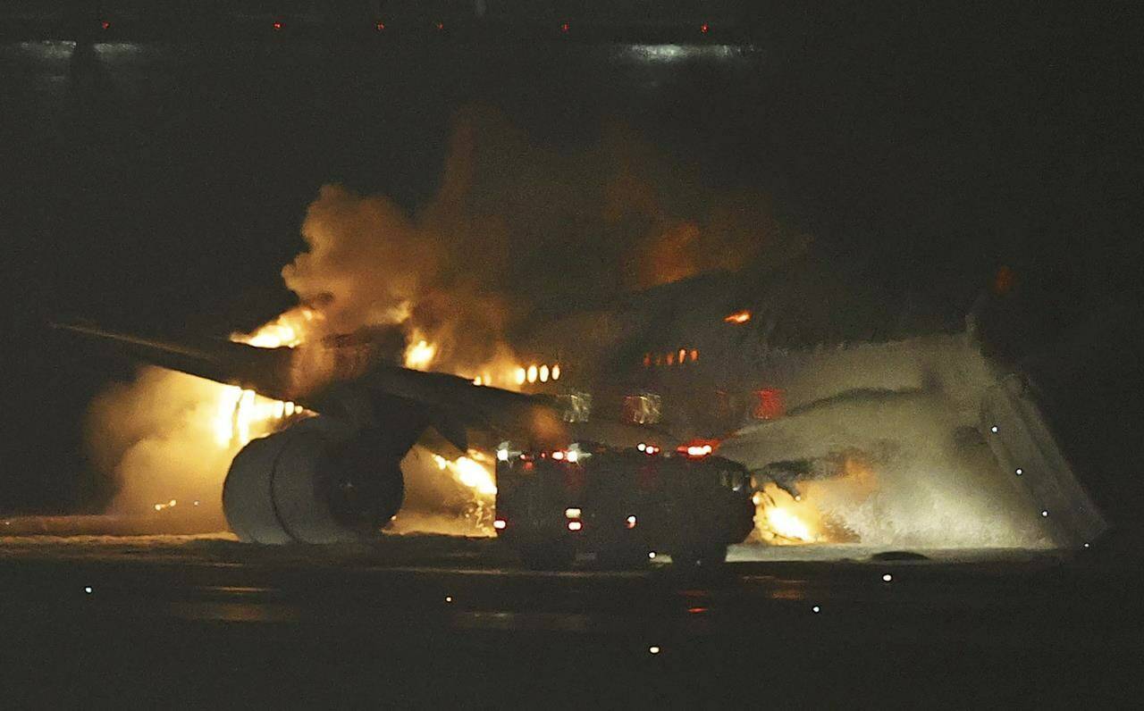 A Japan Airlines plane is on fire on the runway of Haneda airport on Tuesday, Jan. 2, 2024 in Tokyo, Japan. (Kyodo News via AP)