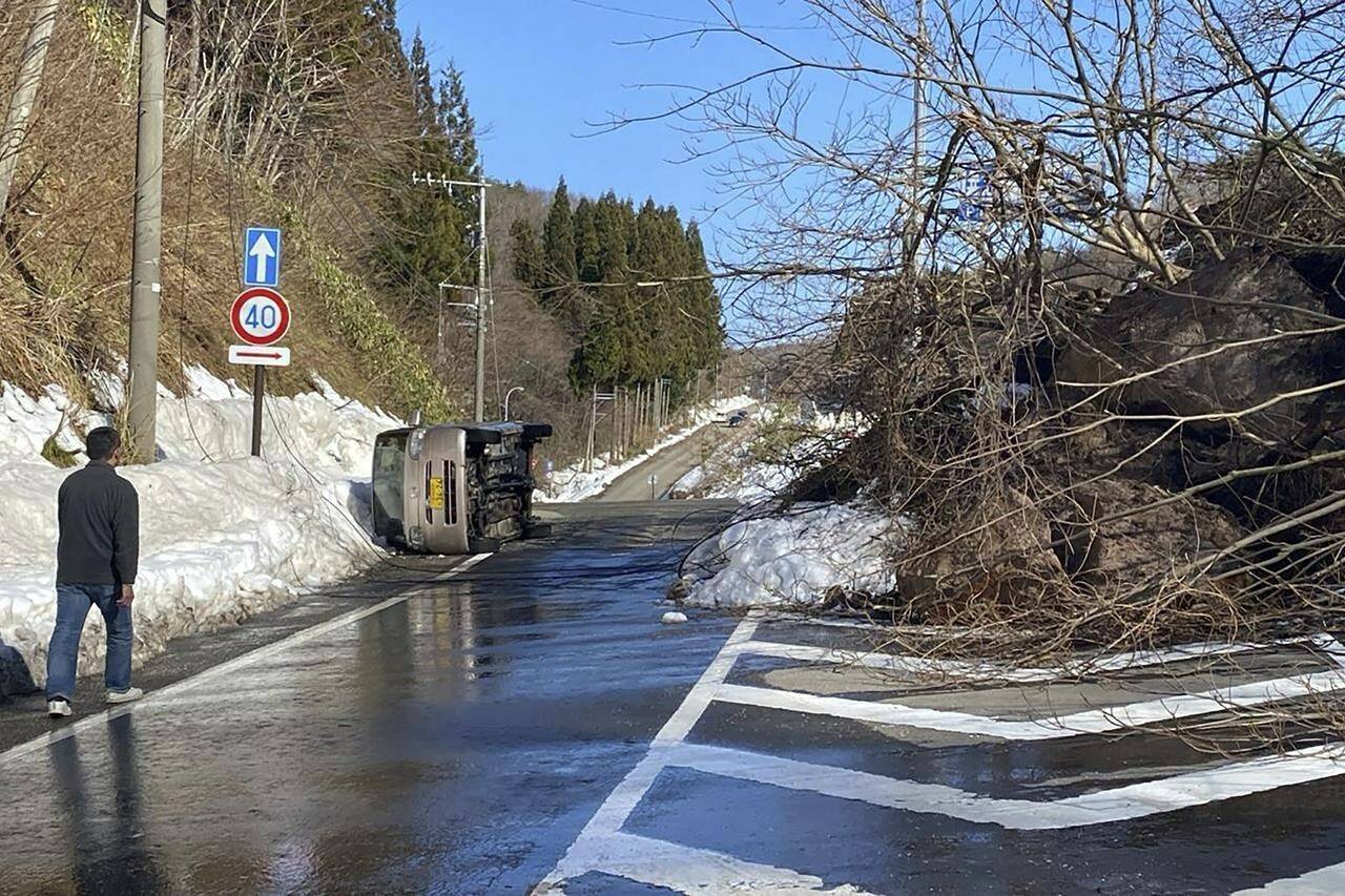 A road affected by landslide caused by powerful earthquake is seen Tuesday, Jan. 2, 2024, near Noto-cho, Ishikawa Prefecture, after a powerful earthquake hit the central Japanese region on Monday. (AP Photo/Hiro Komae)