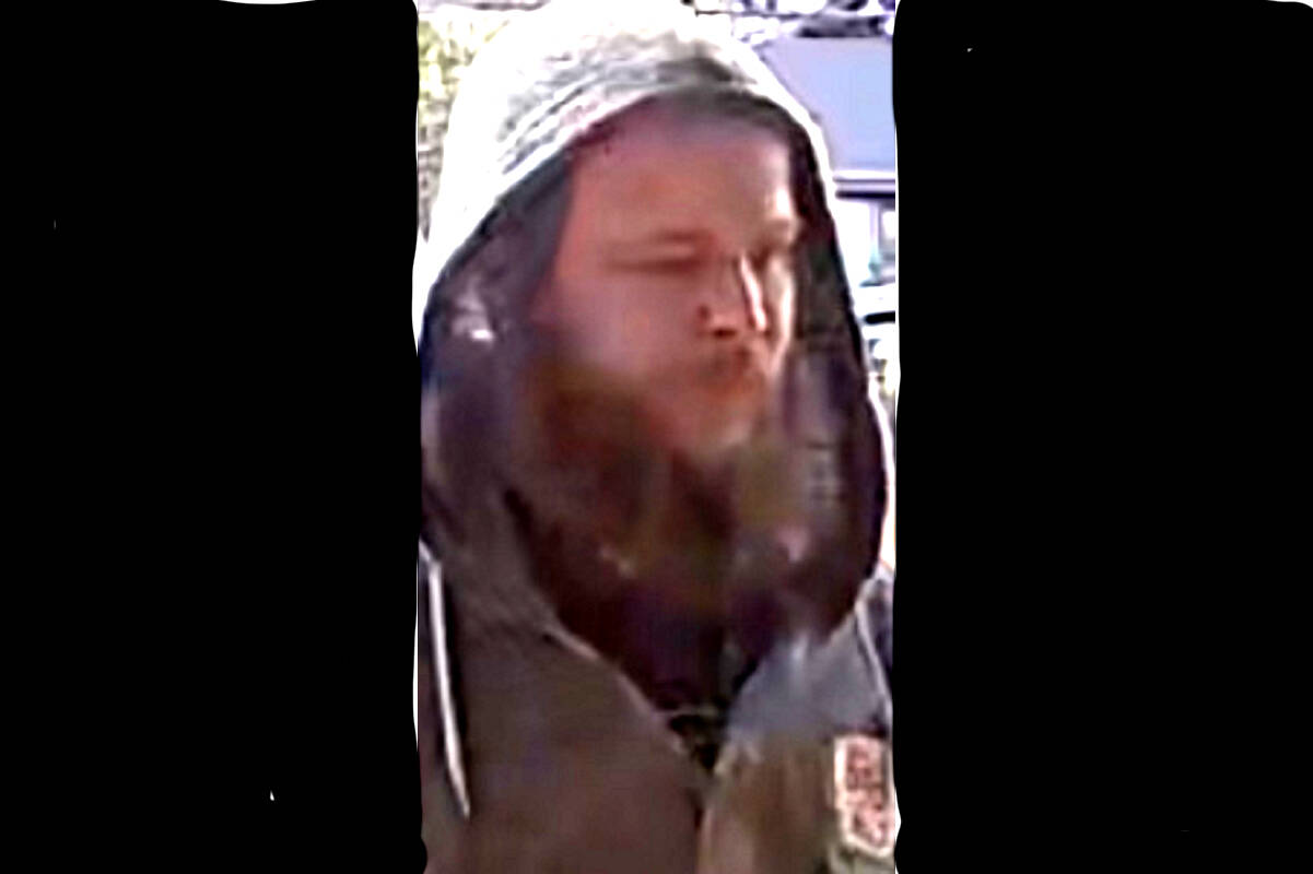 A surveillance camera provided footage of a man police suspect of stealing packages at a home in Qualicum Beach. (Submitted photo)