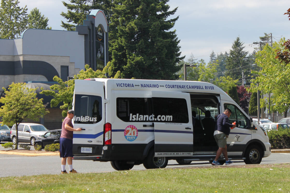 An IslandLink bus drops off passengers in front of Landmark Cinema in Courtenay. (File photo)