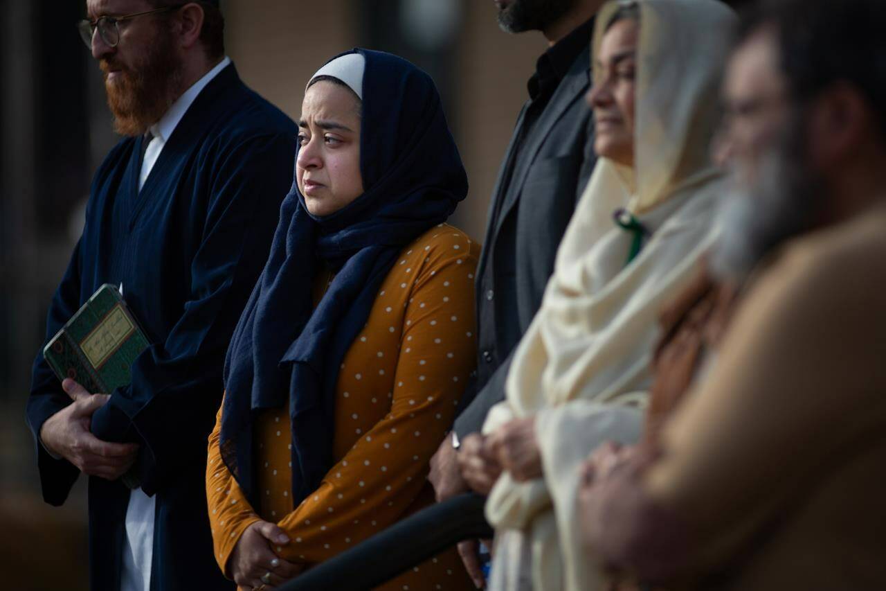 Family and friends of the Afzaal family speak to the media outside Superior Court of Justice in Windsor, Ont., after a verdict in the Nathaniel Veltman murder trial was reached, on Thursday, Nov. 16, 2023. Veltman’s killings on June 6, 2021 in London Ont. have prompted calls for Canada to confront Islamophobia and raised new concerns about the threats of online radicalization. THE CANADIAN PRESS/Dax Melmer