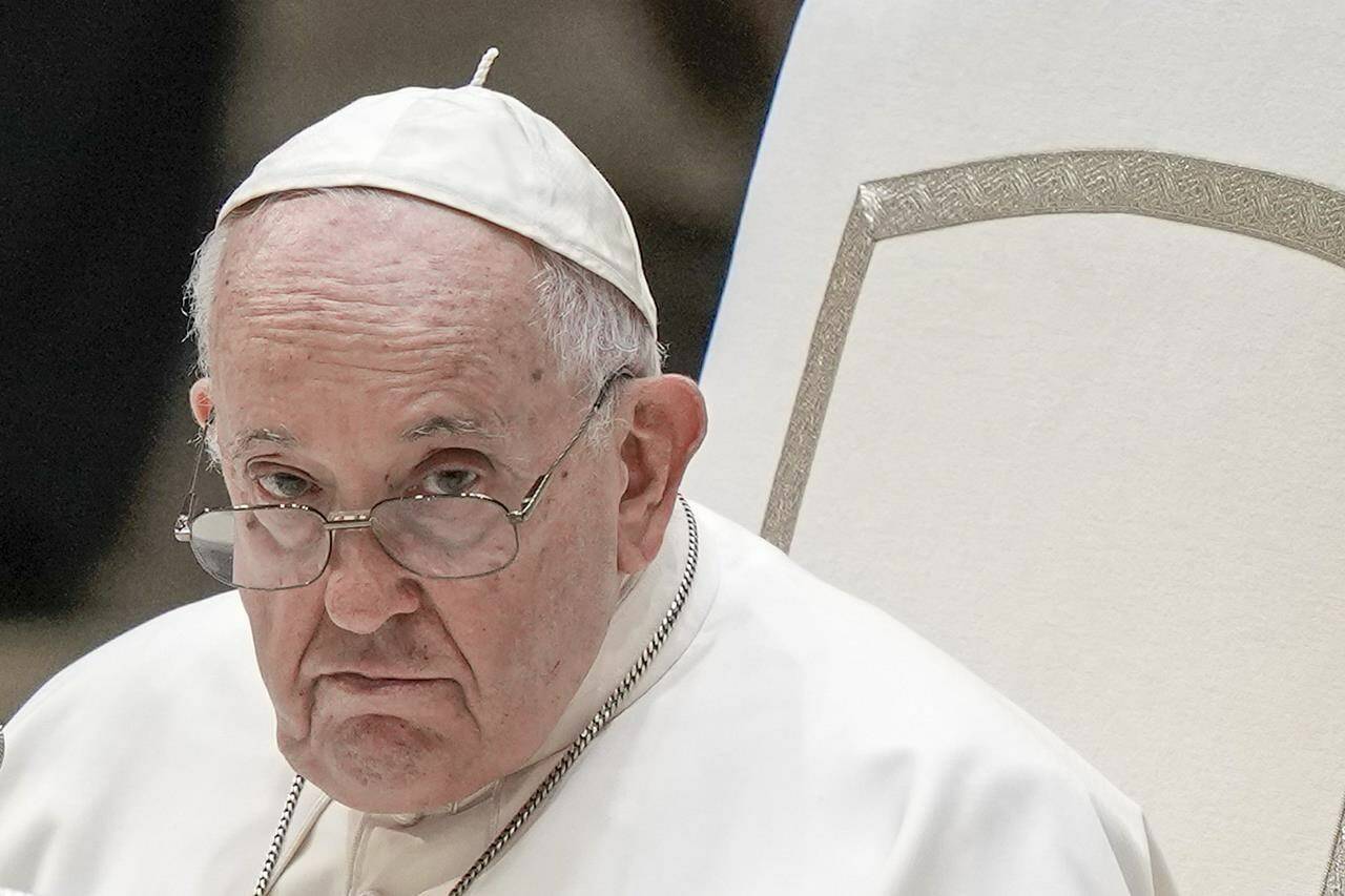 FILE - Pope Francis attends his weekly general audience in the Pope Paul VI hall at the Vatican, Wednesday, Aug. 23, 2023. Pope Francis called Monday, Jan. 8, 2024, for a universal ban on the “despicable” practice of surrogate motherhood, as he included the “commercialization” of pregnancy in an annual speech listing the threats to global peace and human dignity. (AP Photo/Andrew Medichini, File)