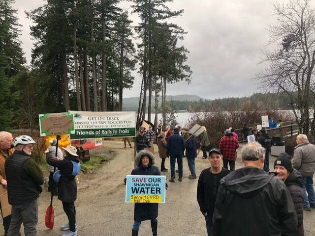 Dozens of people protesting phase three of the Shawnigan Village Rail Trail project temporarily delayed work at the site on Jan. 5, 2024. (Submitted photo)
