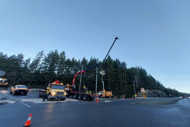 The northbound exit to Shawnigan Lake remains closed as crews replace a pole after an early morning crash Jan. 11. (Emcon Services South Island Division/X)