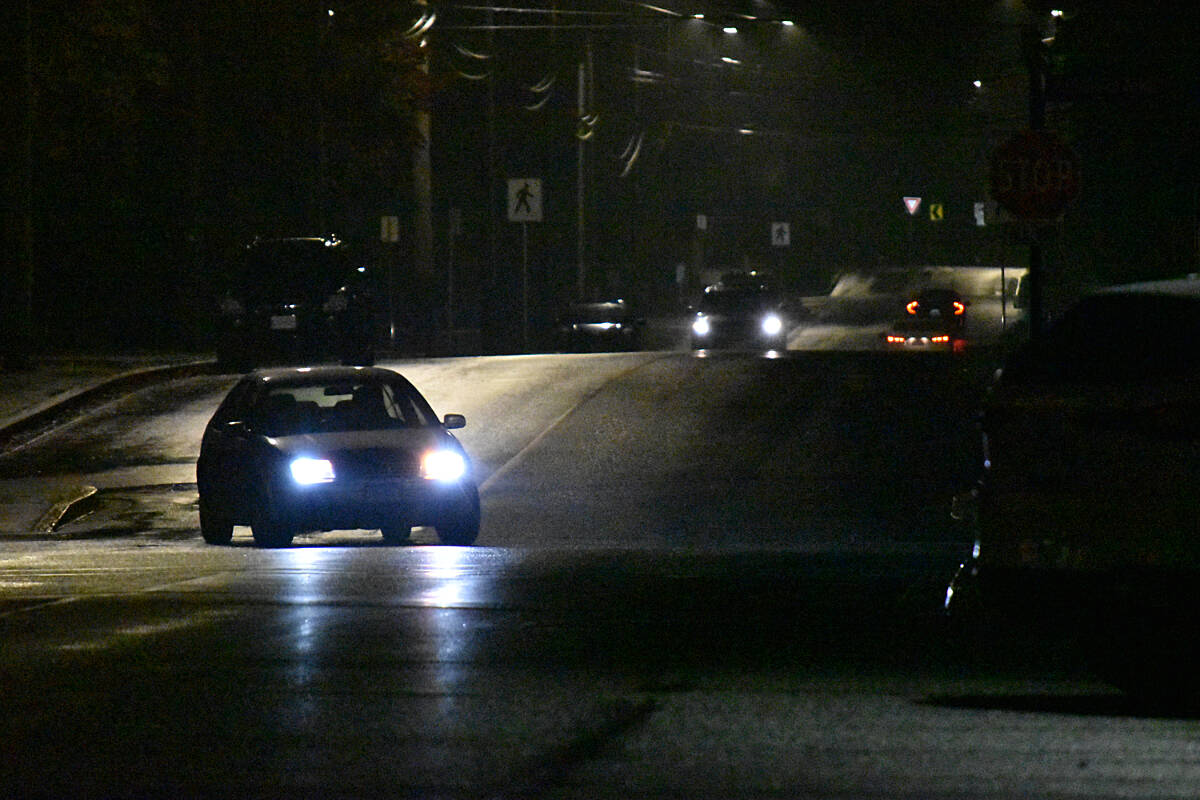 A car is seen in downtown Courtenay on the night of Friday, Oct 13, 2023. Courtenay council on Thursday passed two readings of a new bylaw that would help the city regulate the use of temporary sheltering within parks and open spaces in the city. (Connor McDowell/Comox Valley Record)