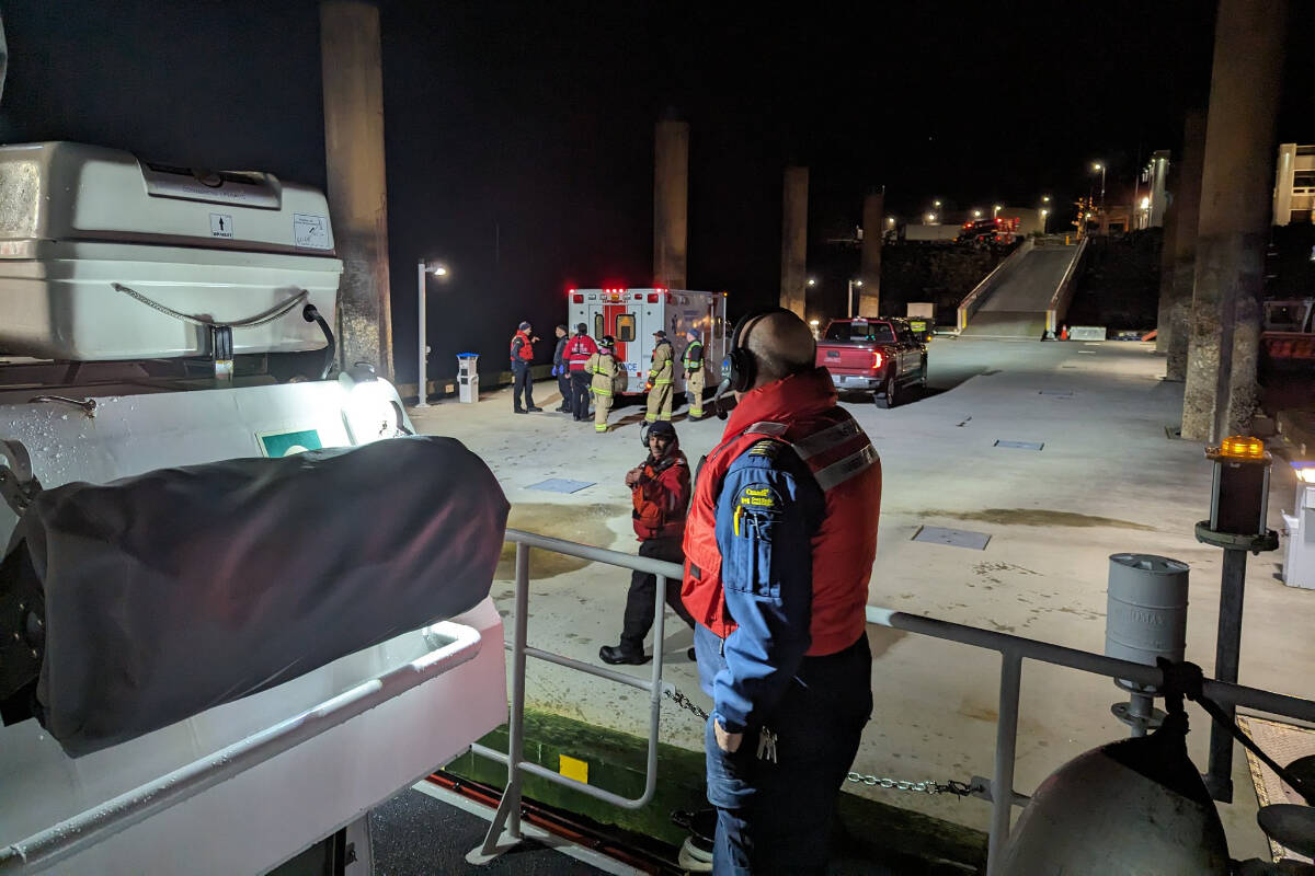 Emergency personnel were on scene at the dock to help the four boaters after being rescued. (Canadian Coast Guard photo)