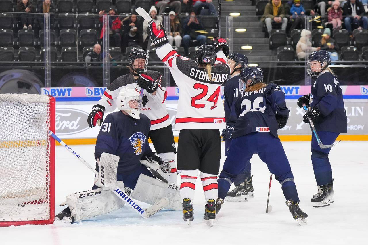 Canada’s Abby Stonehouse, 24, celebrates with teammate Sienna D’Allessandro, 14, after scoring a first period goal against Finland goalie Kerttu Kuja-Halkkola during bronze medal game action at the 2024 IIHF Ice Hockey U18 Women’s World Championship on Sunday January 14, 2024 in Zug, Switzerland. THE CANADIAN PRESS/HO-International Ice Hockey Federation-Andre Ringuette